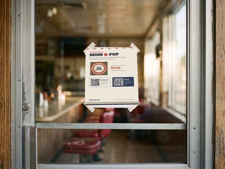 A Mom & Pop poster on a diner door